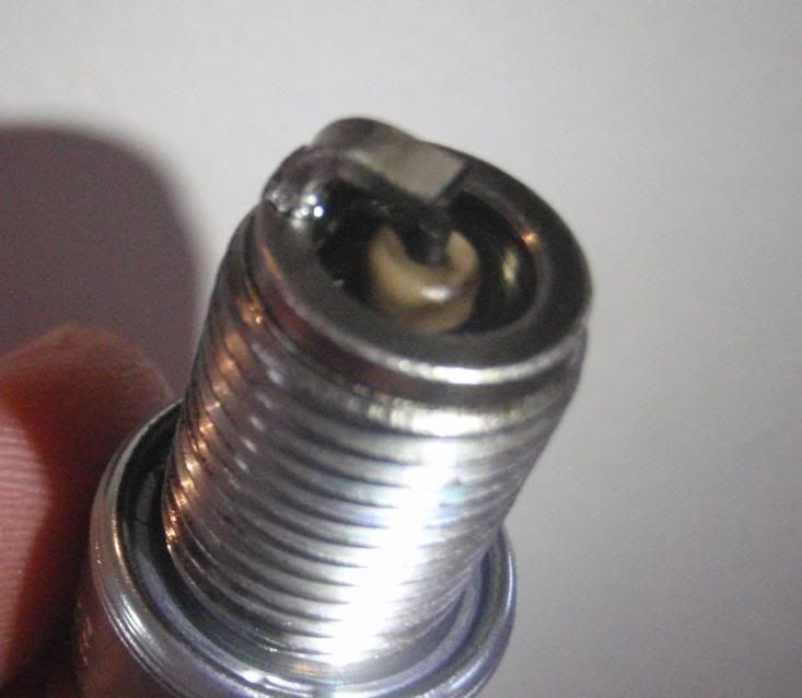 wet spark plugs symptoms